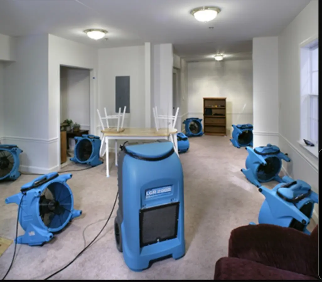 Air movers and dehumidifier setup for Water Damage Restoration in Altus